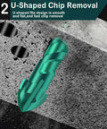 Green tungsten-carbide masonry drill bit with spiral flutes on concrete surface