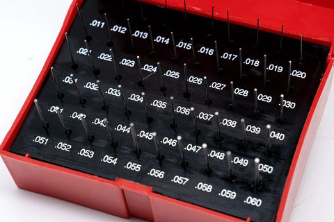 Steel Pin Gauge Set With Plastic Case 50 Pieces 0.011 To 0.060 Inch Range, 2 Inch Long, Hardened 60/62 RC, Tolerance Plus Minus 0.0002 Inch, Ideal For Hole Size And Spacing Checks In The Shop For Machinists. red plastic case with steel pin gauges labeled 0.011 to 0.060 inch