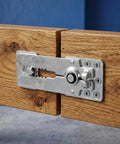 Heavy Duty Stainless Steel Sectional Couch Connectors With Rock Solid Grip And Anti Slip Design on wooden joint close-up