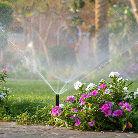 Sprinkler in flower bed using 10 Pack Variable Arc Sprinkler Nozzles for 360 Degree Pop Up Sprinklers Replacement Adjustable Spray Heads