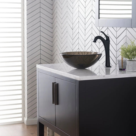 Slick Round Clear Brown Glass Vessel Sink, 14 Inch Above-Counter Bathroom Vanity Basin on modern white countertop.