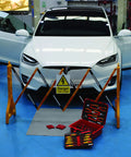 VDE Tool Kit 50 Piece Pro Grade With Sixteen Three-Eighths Inch Drive Sockets shown near electric car setup.