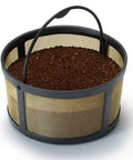 Reusable Gold Tone Mesh Coffee Filter For K Duo Essentials And K Duo Brewers filled with coffee grounds, with handle