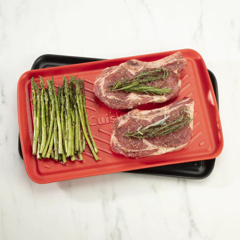 Grilling Prep And Serve Trays Set 17 x 10.5 Inch Dual Nesting Trays Red For Raw Meat And Black For Cooked Food on counter