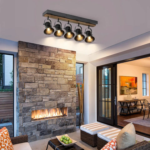 Installed five light adjustable track lighting fixture in industrial black for ceiling in modern home living space.