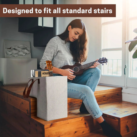 Woman playing guitar near stair basket organizer for carpeted and wooden stairs foldable 16L x 10W x 16H with sturdy handles.