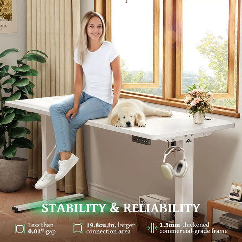 SIAGO 48x24 Inch Electric Standing Desk, 0.8 Inch Thick Tabletop, Rock Solid Stability With 1.5Mm Commercial Grade Frame And 25 Percent Thicker Surface, Height Adjustable Workstation For Home Office Ergonomic Workspace No Wobble, showcasing a woman sitting beside a relaxed puppy on a modern desk.