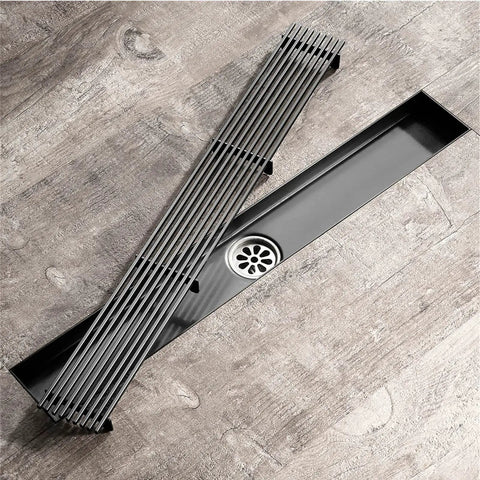Total Upgrade Linear Shower Drain In Stainless Steel With Removable Grate and Efficient Hair Catcher For Flawless Smooth Draining No Clogs Nonsense For Your Dream Bathroom Rose Gold on wooden floor.
