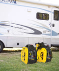 2500 Watt Dual Fuel Portable Inverter Generator With Quiet Technology and CO Shield next to RV on grass