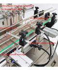 Close-up view of Top Shelf Automatic Pneumatic Filling Machine With Magnetic Pump and components like filling nozzles and conveyor.