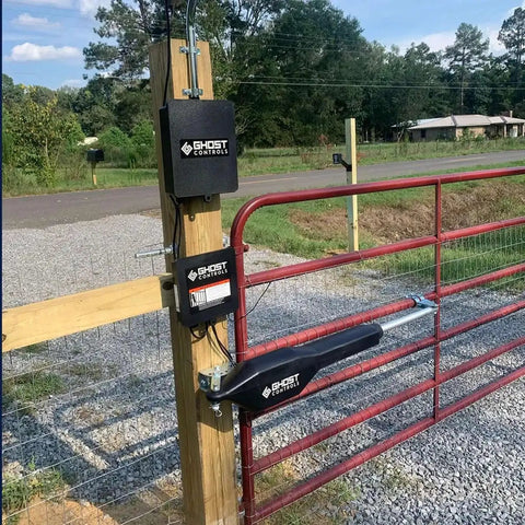 Legit Heavy Duty Automatic Swing Gate Opener Kit With Smart Ready Motor And Dope Long Range Remote Control For Residential Driveway Up To Nine Hundred Pounds mounted on a wooden post with red gate.