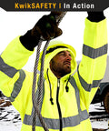 Man wearing Men's Reflective Safety Jacket Fleece Hoodie Yellow High Visibility Class 3 ANSI OSHA Compliant in snowy environment