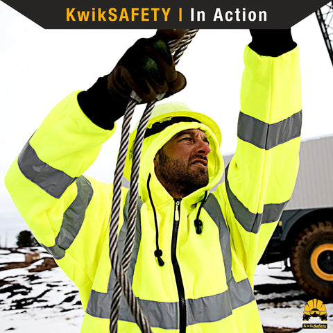 Man wearing Men's Reflective Safety Jacket Fleece Hoodie Yellow High Visibility Class 3 ANSI OSHA Compliant in snowy environment