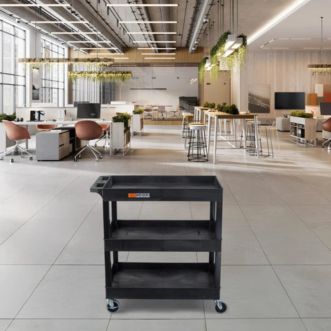 Three Tier Rolling Utility Cart With Locking Wheels Heavy Duty Cart Supports 300 Lbs Ideal For Garage Kitchen And Office Storage Durable Plastic Shelves Black 32 By 18 Inches displayed in an office setting.