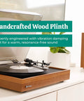 Electrohome Montrose Vinyl Record Player With Belt Drive Turntable And Audio-Technica Stylus Speed Control Motor Built-In Preamp Wood Plinth showing handcrafted design and vibration damping for clear sound.