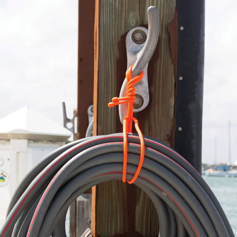 Orange Reusable Rubber Twist Tie bundling cable on dock hook, 18 inch, bendable rubber exterior for DIY projects and organization.