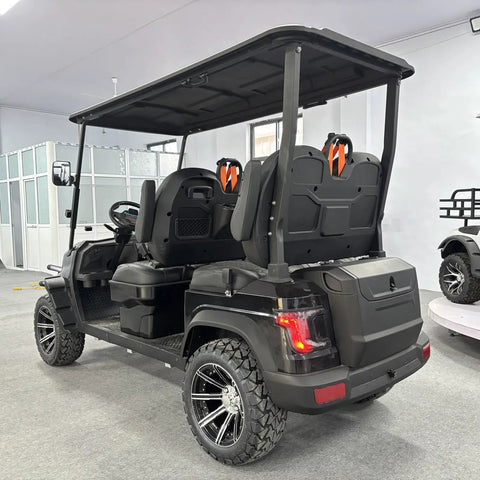 Top Tier Electric Golf Cart 4 Seater Loaded Up With 48V Power Motor Premium Stitched Seats All Terrain Capable Heavy Duty Weekend Warrior View from rear showcasing seats and tires.