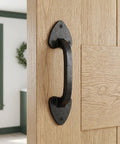 Heavy Duty Rustic Barn Door Handles Set Of 3 Cast Iron Gate Pulls with aged finish on light wood door