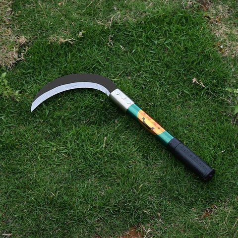 Heavy Duty Weeding Sickle With Manganese Steel Blade And Hardwood Handle Serrated Grass Hook Cutter For Yard Ready Removal Of Unwanted Vines And Weeds In The Garden resting on grass.