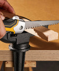 KATA folding drywall jab saw with soft-grip yellow/black handle and serrated blade cutting wood block