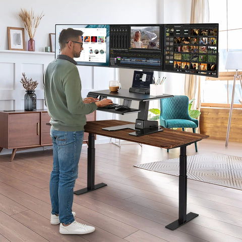 Avlt Electric Standing Desk Converter Fits Triple 32 Inch Monitors in use, showing ergonomic sit-stand height adjustment.