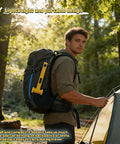 Man hiking with Camping Tent Stake Hammer With Puller Ultralight Nine Point Eight Four Inch Mallet Yellow PE Plastic on backpack