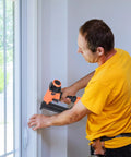Man using Premium 18 Gauge Brad Nails 1-1/4 Inch Smooth Shooting Steel Fasteners For Pneumatic And Electric Brad Nailer.