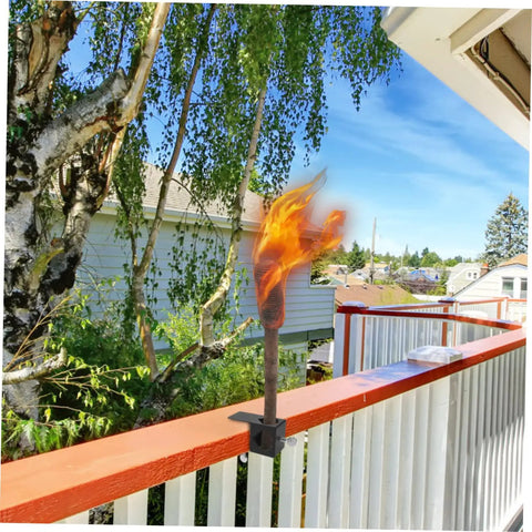Adjustable Deck Torch Clamp Mount For Outdoor Railing Universal Metal Base For Tiki Torches And Decorative Lighting Secure Porch Rail Holder For Patio Parties And Backyard Vibe Night Lighting installed on a wooden railing outdoors.