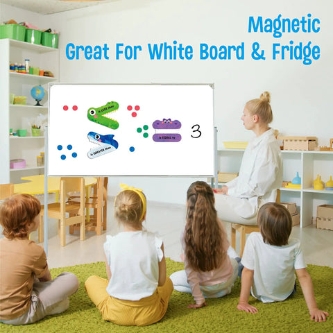 Teacher using Magnetic Greater Than Less Than Equal Signs Math Set for Classroom Demonstrations on a whiteboard with students.