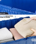 14 Gallon Industrial Plastic Tote Hinged Flip Lid Boss Level Storage Bin Pack Of 6 Heavy Duty Rugged Containers with folded sweaters inside.