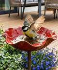 Bird bathing in Handmade Metal Flower Garden Stake With Bird Bath And Bee Watering Station Totally Pollinator Friendly Yard Decor