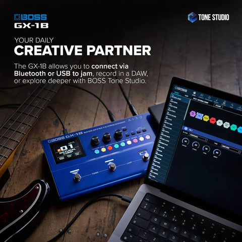 Ultra Portable Bass Effects Processor With Iconic Amps And Effects And AIRD Sound Engine For Beginner Bassists Bluetooth Connectivity Flexible Power Options Pro Tone On The Go next to laptops and guitar cables on a wooden floor
