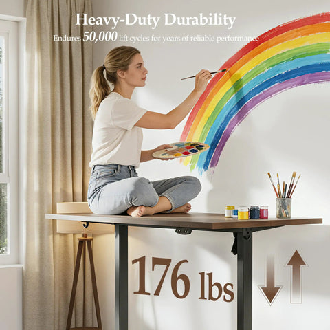 Klicelor 48 x 28 Electric Standing Desk With Memory Presets And Hooks height adjustable, artist painting on spacious dark walnut surface.