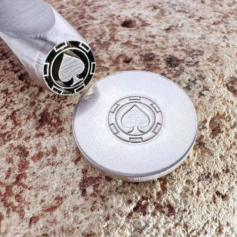 Pro Grade Metal Signature Stamp For Jewelry And Metalwork tool with crisp spade logo imprint on stainless steel, angled view