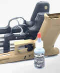 BP2000 Dry Powder Lubricant For Triggers Bores Bolts And Slides Reduces Friction And Keeps Surfaces Oil Free And Dry Ideal For Hinges Locks And High Wear Areas No Mess Application 0.1 Oz Bottle shown with firearm parts