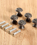 Five Pack Antique Brass Tiny Round Cabinet Knobs For Drawers And Cabinets, 17x15mm Iron Drawer Pulls With M4x25mm Screws, Vintage Style Hardware With Anti Rust Finish, Durable Mini Round Knob Handles. Five antique brass round cabinet knobs with screws on wood