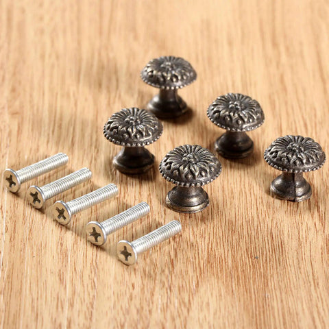 Five Pack Antique Brass Tiny Round Cabinet Knobs For Drawers And Cabinets, 17x15mm Iron Drawer Pulls With M4x25mm Screws, Vintage Style Hardware With Anti Rust Finish, Durable Mini Round Knob Handles. Five antique brass round cabinet knobs with screws on wood