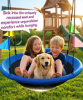 Two children and a dog sitting on Blue 48 Inch Saucer Tree Swing With Straps, Heavy Duty 600 Lb Weight Capacity, Outdoor Backyard Playground