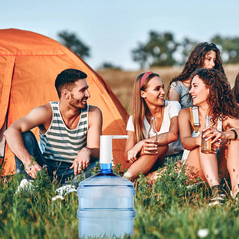 Camping group using Portable 5 Gallon Water Dispenser Pump With USB Rechargeable Battery next to orange tent and 5-gallon bottle