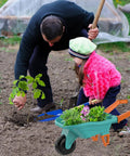 Child using Kids Gardening Set With Wheelbarrow For Ages 3 To 8 Real Metal Garden Tools 14 Piece Outdoor Kit in garden