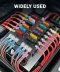 Close-up of a fuse box with Marine Grade Heat Shrink Ring Terminal Kit 112 Pcs installed, showing colored crimp connectors in use.
