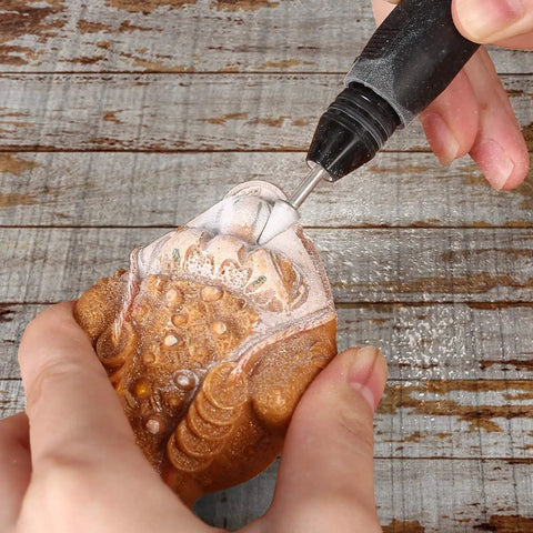 Using a Diamond Grinding Burr Bit Set For Rotary Tools 30 Pcs With One Eighth Inch Shank Diamond Coated Burrs on stone carving