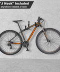 Mountain bike hanging on wall using "J Hook" from Heavy Duty Garage Hooks 20 Pack Steel Wall Mount Hooks With Anti Slip Coating.