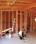 Worker installing Saf-T-Brace 3 Teeth Twist And Lock Heavy-Duty Install Bracket for fans and fixtures in unfinished room