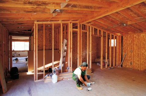 Worker installing Saf-T-Brace 3 Teeth Twist And Lock Heavy-Duty Install Bracket for fans and fixtures in unfinished room