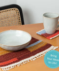 Handmade woven placemat and coaster on table, using Beginner Friendly Weaving Loom Kit For Adults And Kids Totally Easy To Start All In One Table And Lap Loom Wooden Loom With Yarn Tools And Step By Step Video Tutorials For Multicraft Projects.