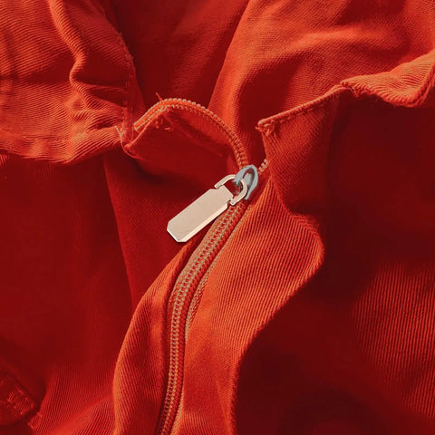 Heavy Duty Metal Zipper Pull Tabs Replacement Set With Super Straightforward Tool Free Install For Jacket Fixes Clothing Repairs On Red Fabric.
