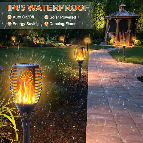 Garden path lit by 8 Pack Solar Torch Lights With Flickering Flame That Looks Lit, Upgraded 3in1 Outdoor Hanging Lanterns.