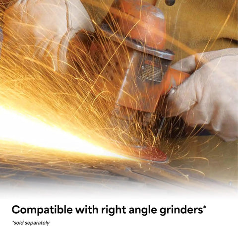 Worker using Cubitron II Fiber Disc 36 Plus Grade Coated Ceramic Brown for heavy-duty metal grinding with sparks flying