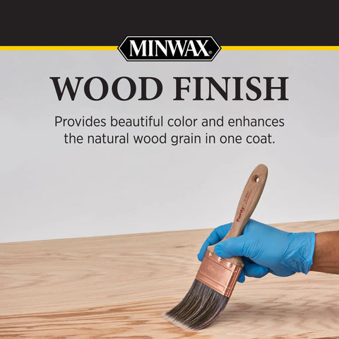 Premium Oil Based Wood Stain In Warm Natural Tone For Cabinetry And Furniture Quick Drying Formula applied with brush on wooden surface.